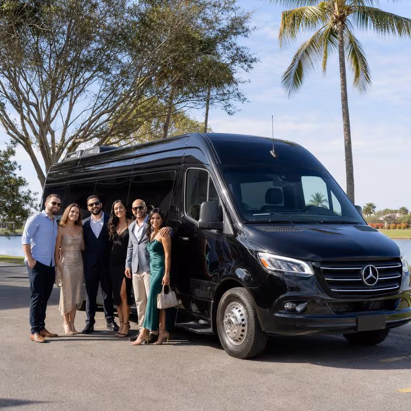 Group beside a Mercedes Sprinter limo from the Wellington fleet