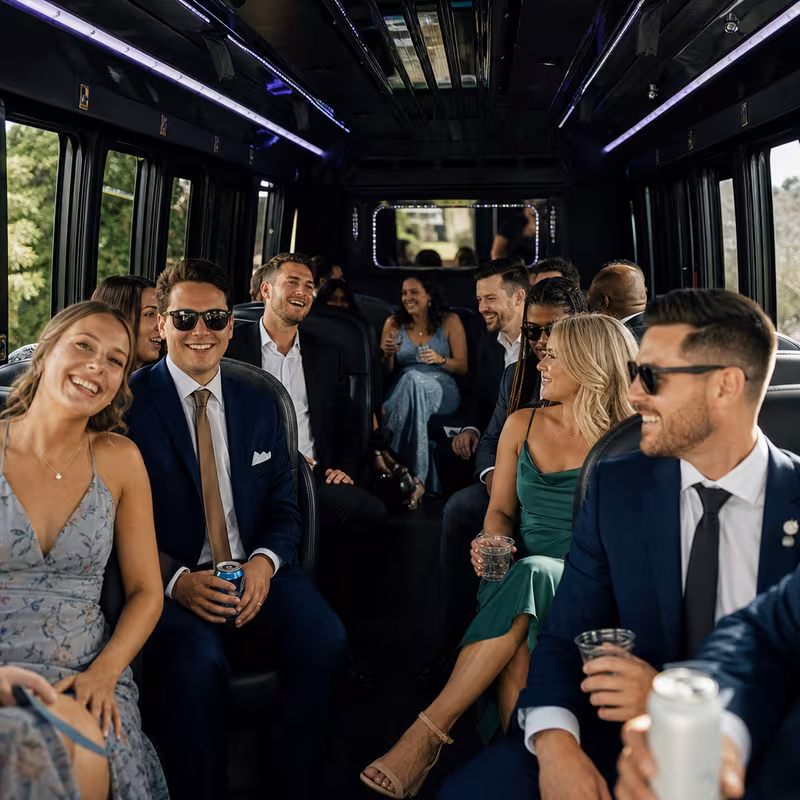 Wedding guests seated inside a Wellington party bus