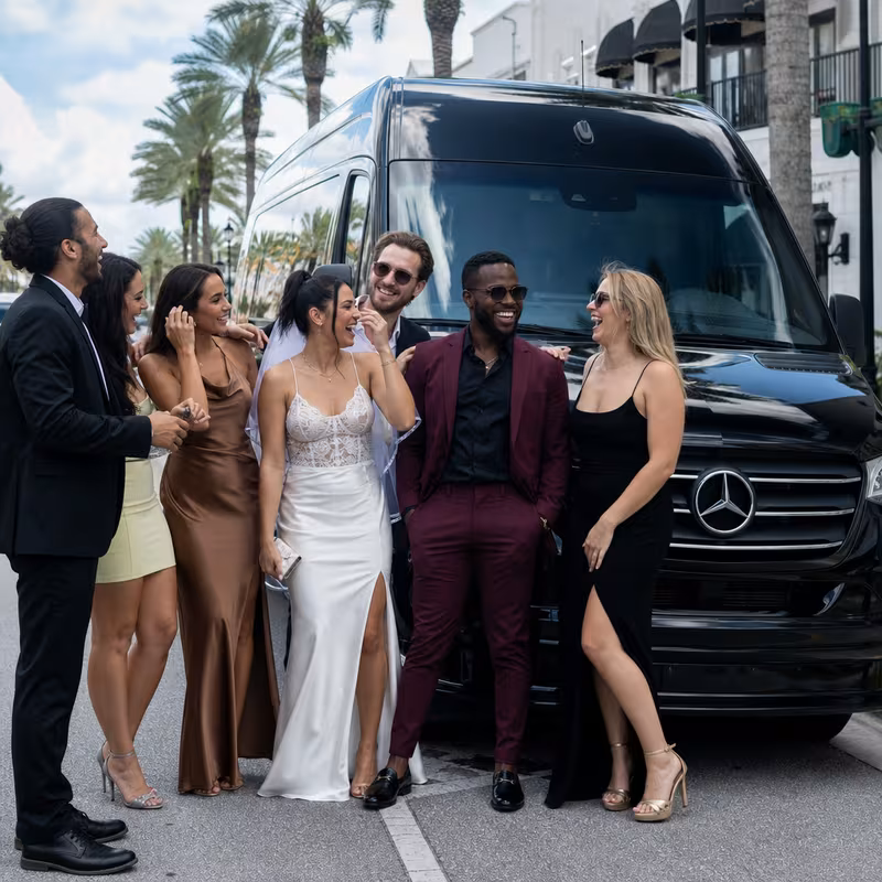 Group boarding a white charter bus for Bachelor & Bachelorette Transportation transportation in Wellington